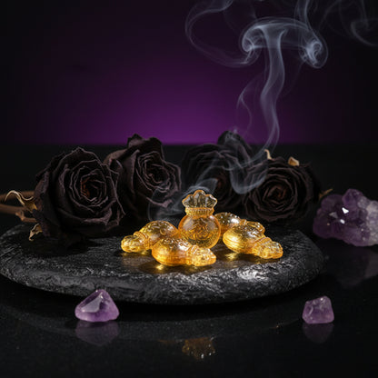 Yellow crystal figurines on a blue and white checkered surface with a wooden background.