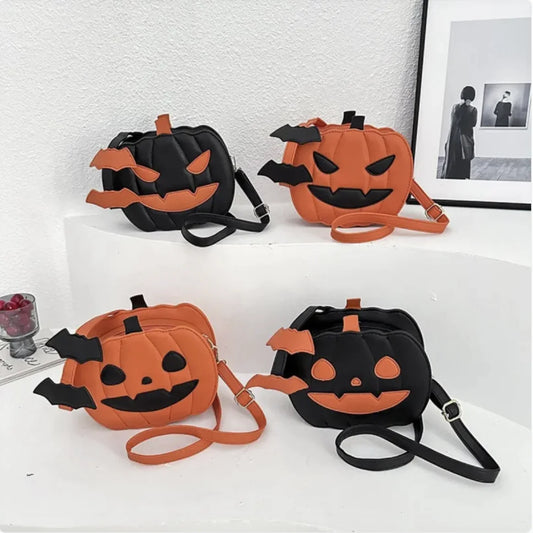 Four Halloween-themed pumpkin bags on a white surface with a framed picture in the background.