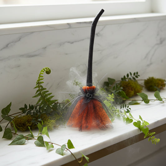 Halloween decoration with black cat ears and orange skirt on a white background