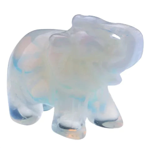 Opalescent glass elephant figurine on a white background