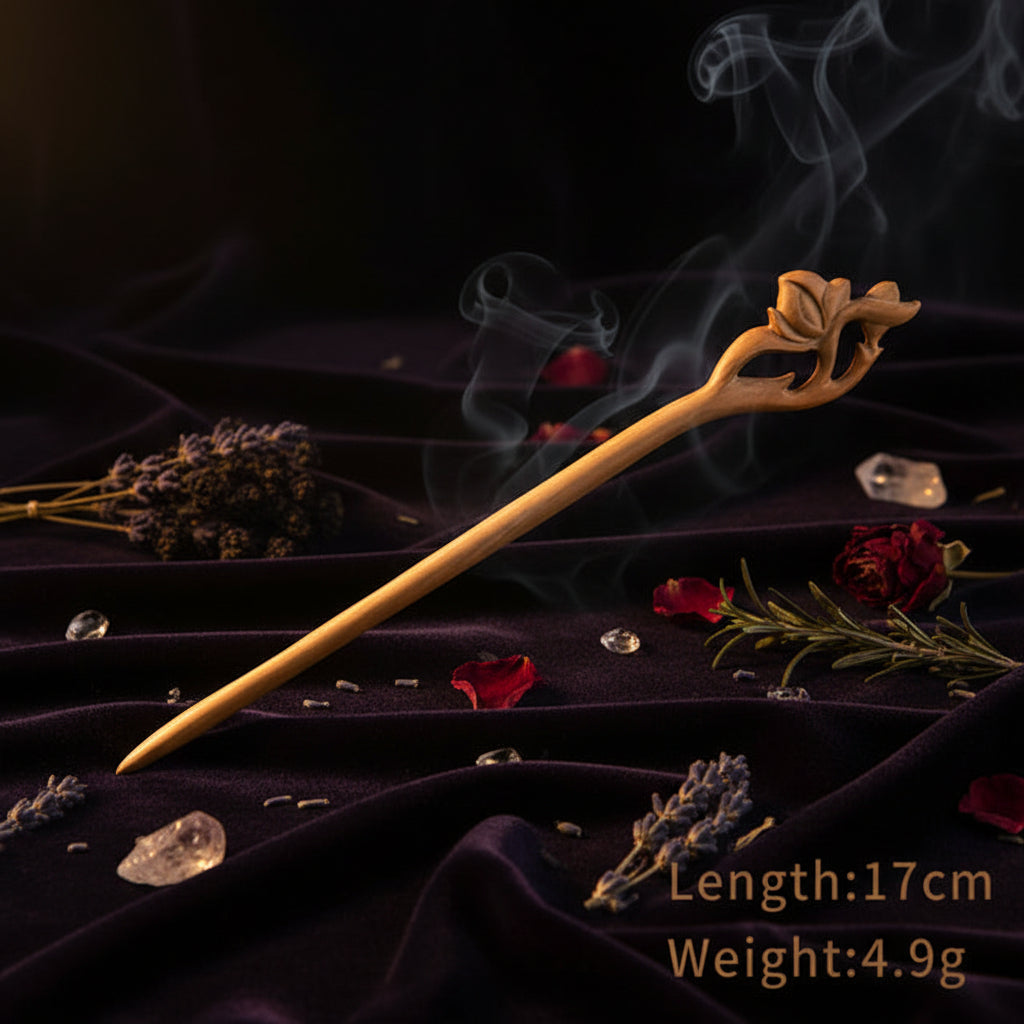 Wooden hair stick with floral design on a white background