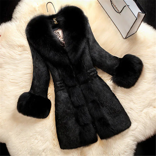 Black fur coat with fox fur trim on a white fur surface