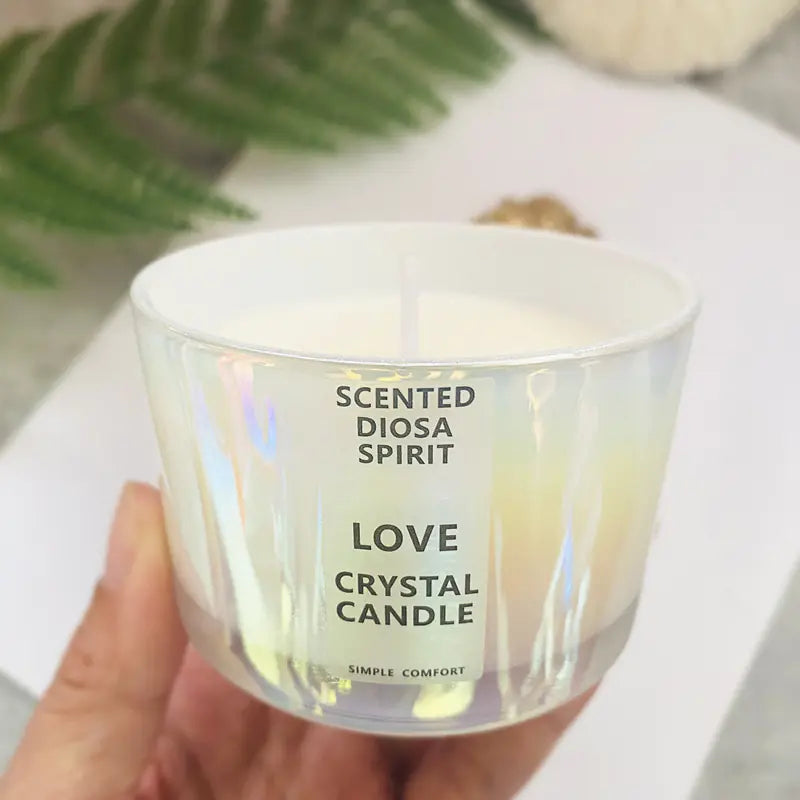 Scented crystal candle labeled 'Love Crystal Candle' held by a hand with a blurred background.