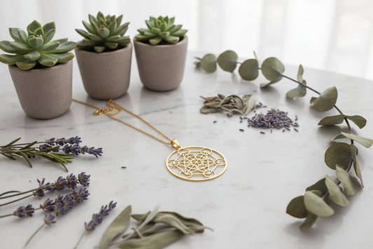 Gold geometric pendant on a black textured background