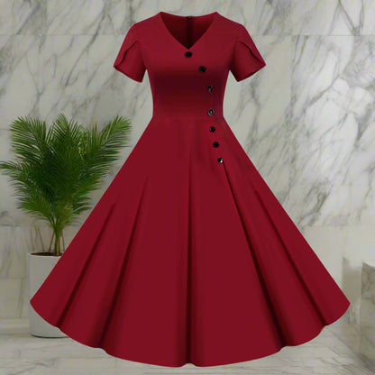 Red vintage-style dress with buttons on a white background