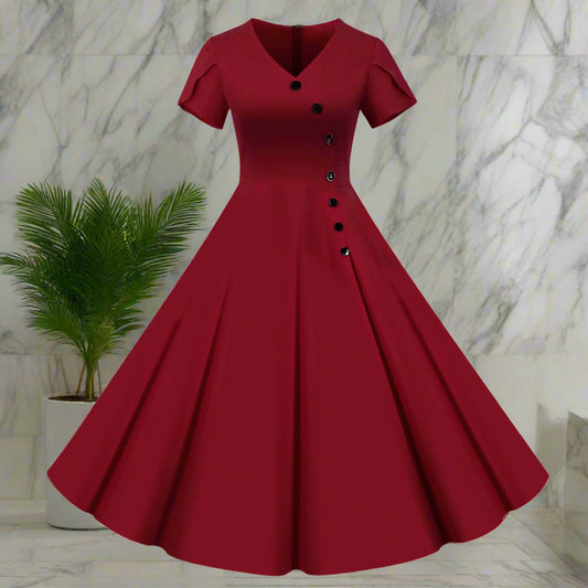 Red vintage-style dress with buttons on a white background