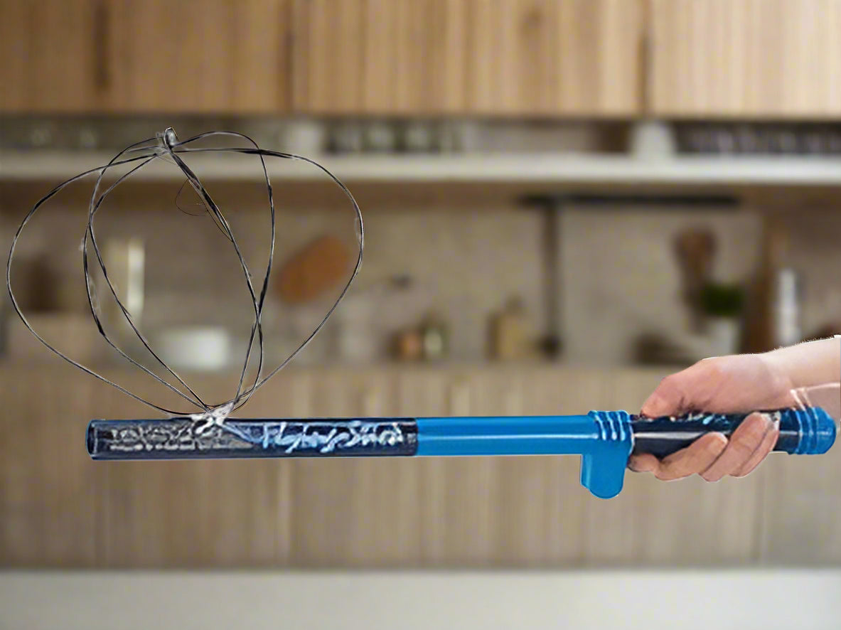Blue toy wand held by a hand against a white background