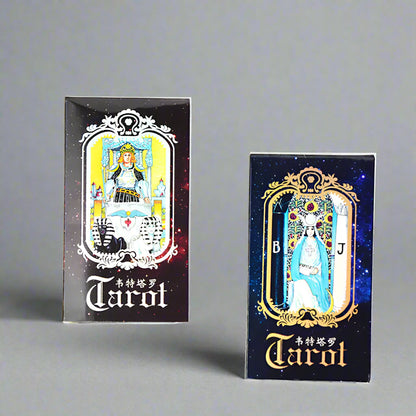 Two tarot card boxes with intricate designs on a white background
