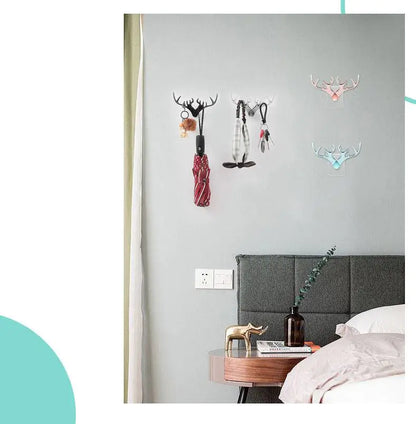Decorative wall hooks on a gray wall above a bed with a nightstand.