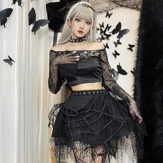 Person wearing a black lace outfit with butterflies in the background