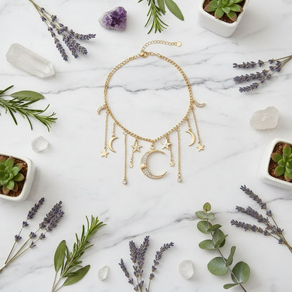 Gold necklace with moon and star charms worn by a person