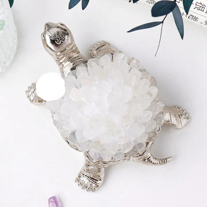 Decorative turtle figurine with crystal shell on a white background