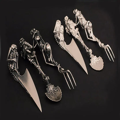 Skeletal design cutlery set on a black background