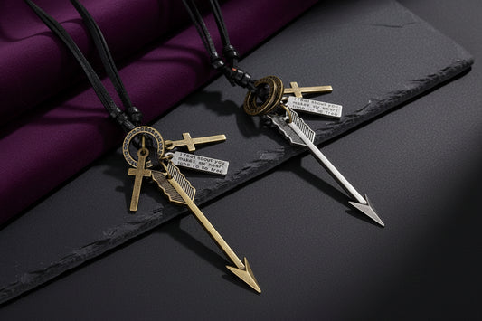 Two necklaces with arrow pendants and engraved tags on a white background