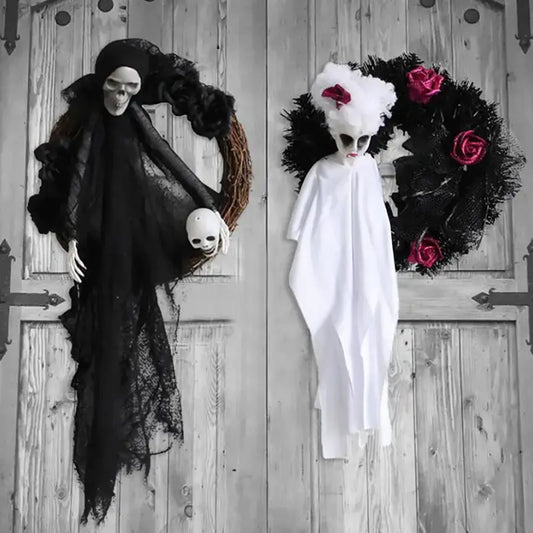 Two Halloween-themed wreaths on a wooden door, one with a skeleton and black lace, the other with a ghost and roses.