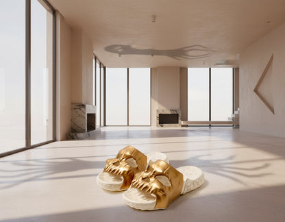 Gold dragon head sandals on a white background