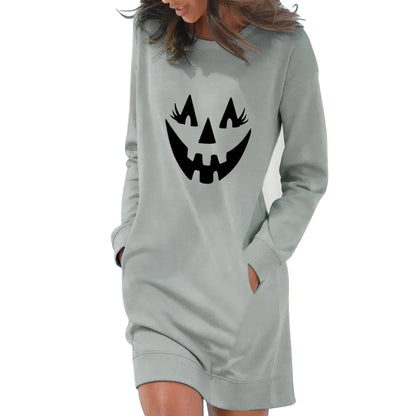 Gray sweatshirt dress with pumpkin face design on a white background