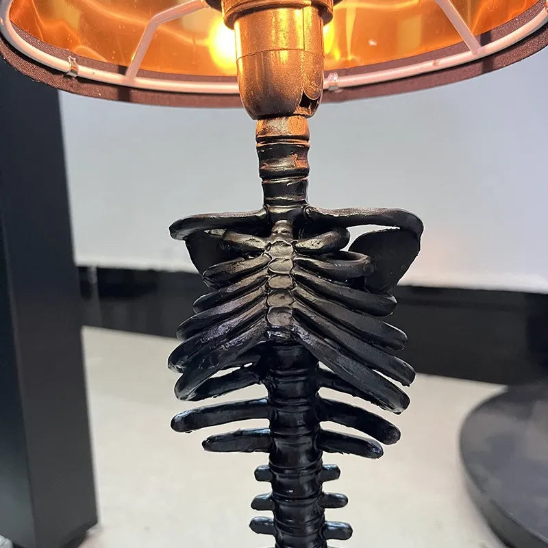 Table lamp with a skeleton design base on a white surface