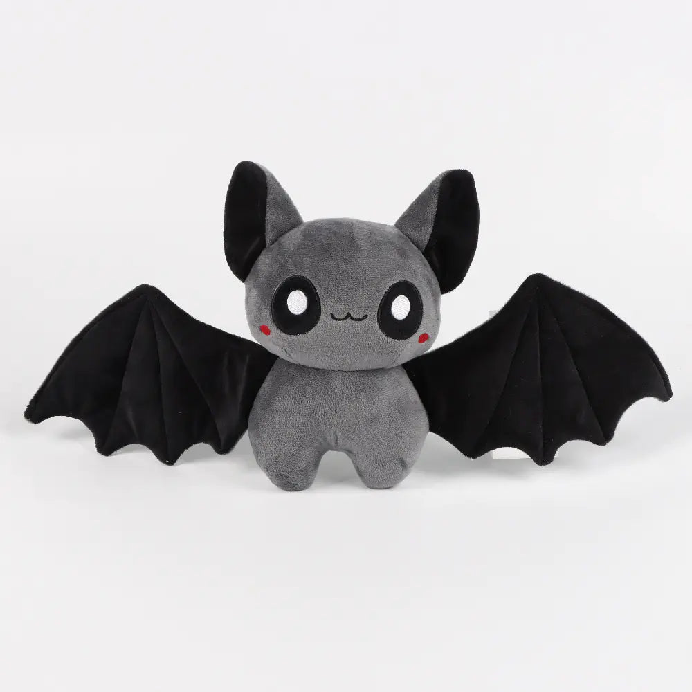 Plush toy bat with black wings on a white background