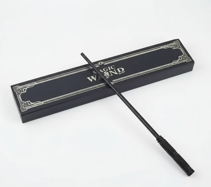 Black magic wand with decorative packaging on a white background