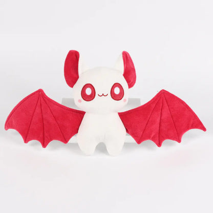 Plush toy with red wings on a white background