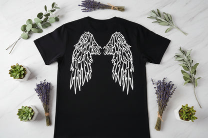Black t-shirt with white angel wings design on a plain background