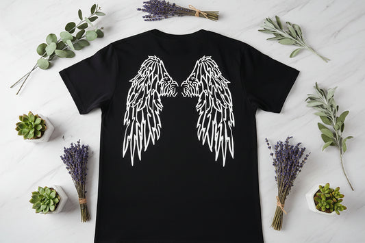 Black t-shirt with white angel wings design on a plain background
